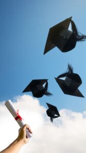 Graduation hats flying